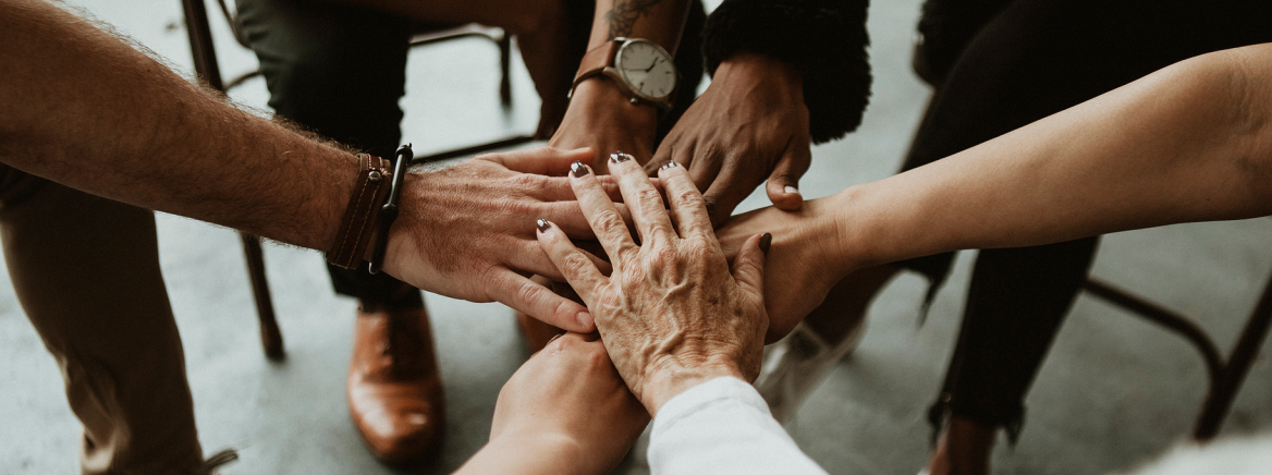 hands holding hands as a sign of mutual support