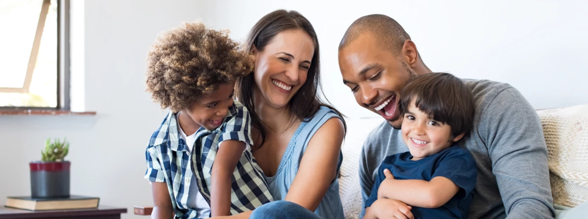 Happy Family A happy family laughing on the sofa.