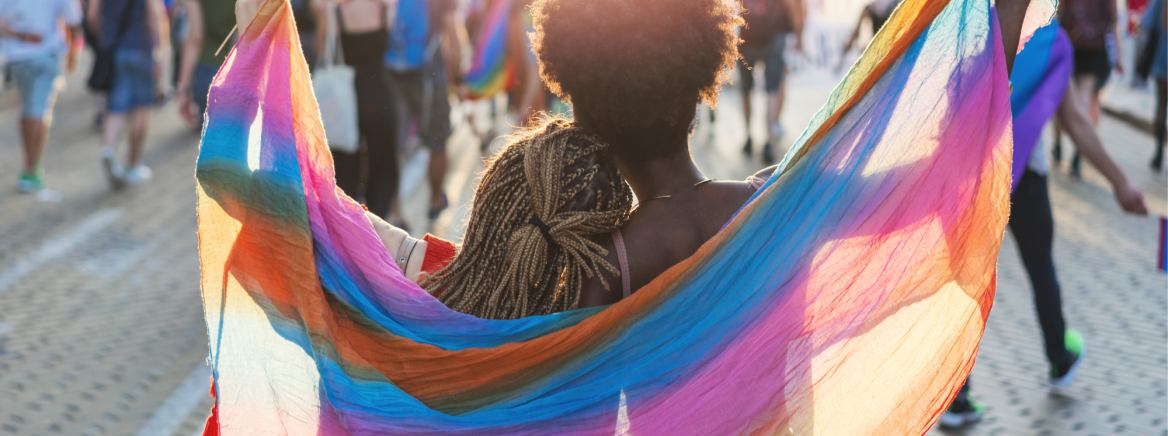 Person waving a pride flag Person waving a pride flag
