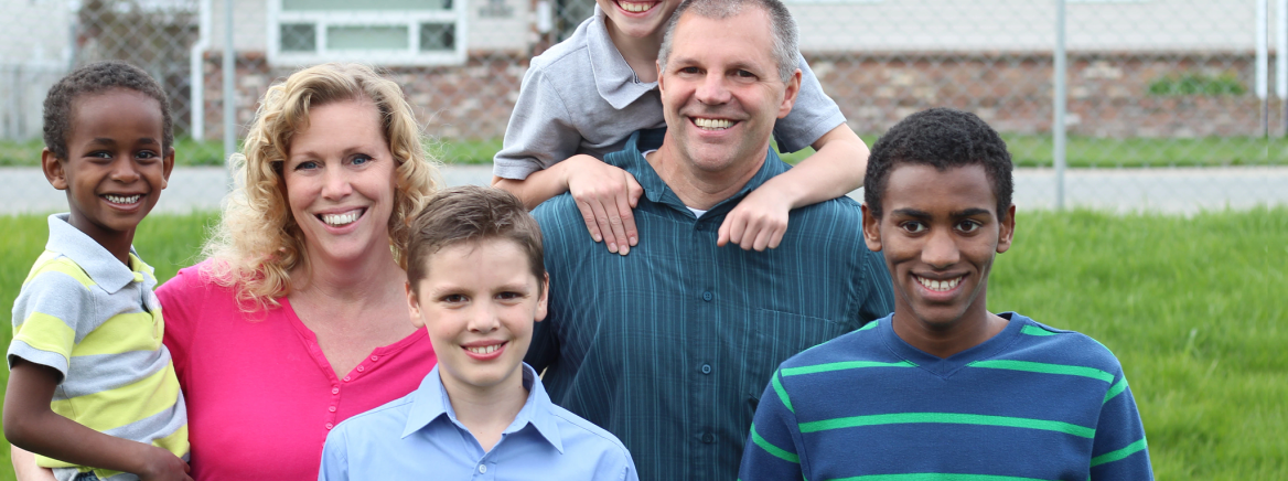 A diverse family smiling