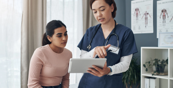 Shot of a young female doctor talking to a patient in an office.