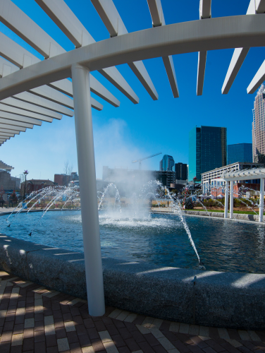 The First Ward Park fountain with the Charlotte skyline in the background. Dec. 2015.