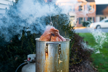 A Thanksgiving turkey being cooked outside