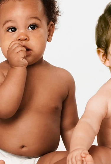 CMARC Hero image - babies sitting in row on floor